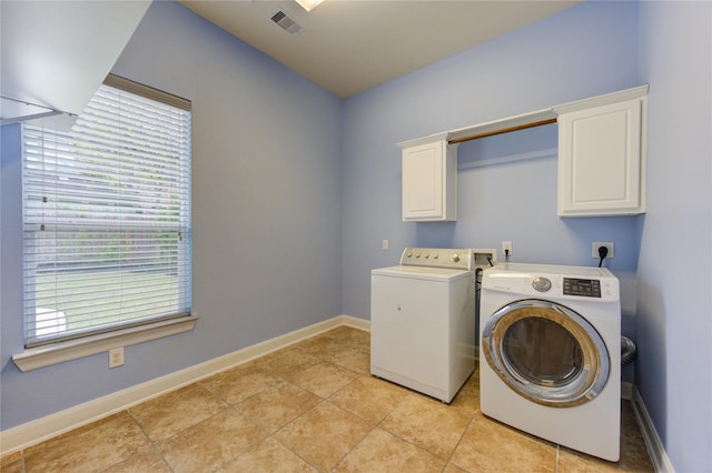 28015 Heritage Stream Dr, Katy, TX 77494 - laundry room featuring cabinet space, washer and clothes dryer, baseboards, and light tile patterned flooring