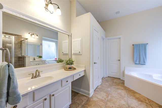 28015 Heritage Stream Dr, Katy, TX 77494 - full bath featuring vanity, a garden tub, a stall shower, tile patterned flooring, and baseboards