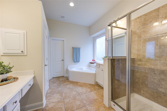 28015 Heritage Stream Dr, Katy, TX 77494 - full bath with vanity, a garden tub, a stall shower, and tile patterned floors