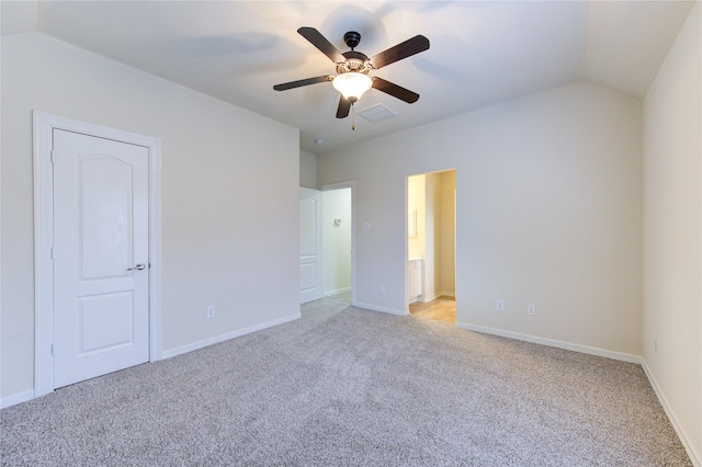 28015 Heritage Stream Dr, Katy, TX 77494 - unfurnished bedroom featuring light colored carpet, lofted ceiling, baseboards, a ceiling fan, and ensuite bath