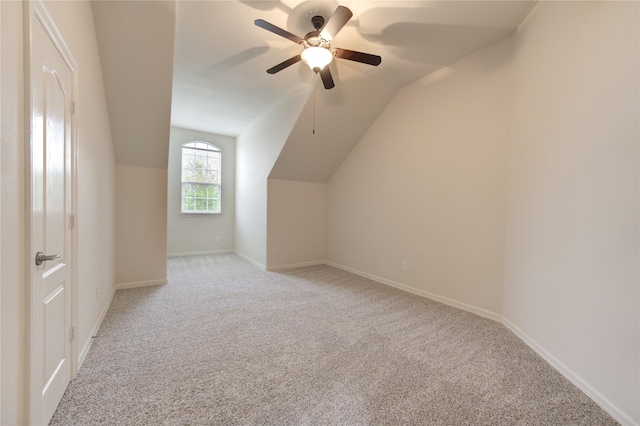 28015 Heritage Stream Dr, Katy, TX 77494 - bonus room featuring light colored carpet, lofted ceiling, a ceiling fan, and baseboards