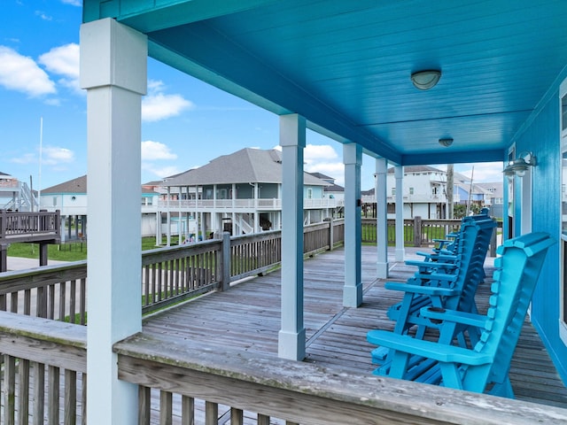 936 Surf Rd, Crystal Beach, TX 77650 - wooden terrace featuring a residential view