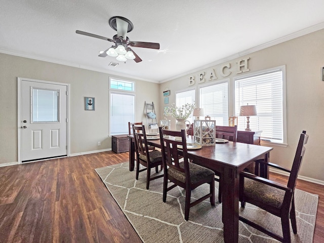936 Surf Rd, Crystal Beach, TX 77650 - dining room featuring wood finished floors, a ceiling fan, baseboards, and crown molding