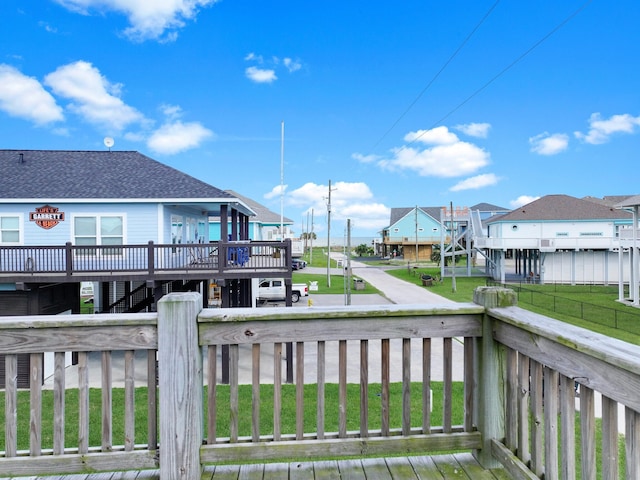 936 Surf Rd, Crystal Beach, TX 77650 - wooden terrace featuring stairs and a residential view