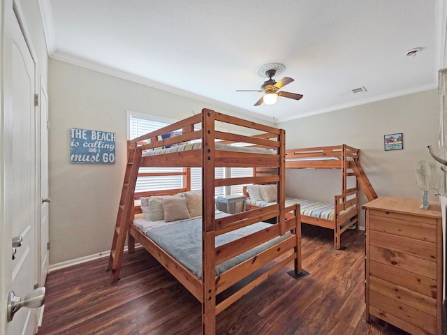 936 Surf Rd, Crystal Beach, TX 77650 - bedroom featuring dark wood-type flooring, crown molding, baseboards, and a ceiling fan