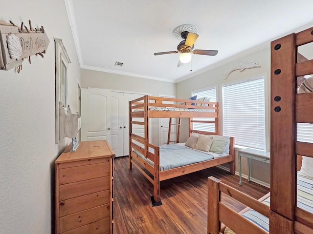 936 Surf Rd, Crystal Beach, TX 77650 - bedroom featuring crown molding, dark wood-type flooring, and ceiling fan
