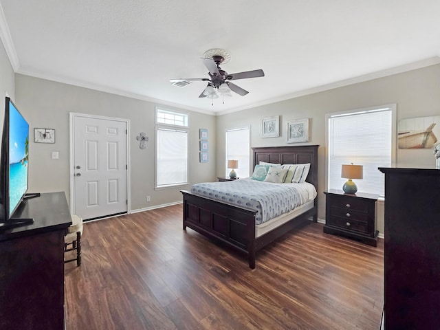 936 Surf Rd, Crystal Beach, TX 77650 - bedroom featuring ornamental molding, dark wood-style flooring, a ceiling fan, and baseboards