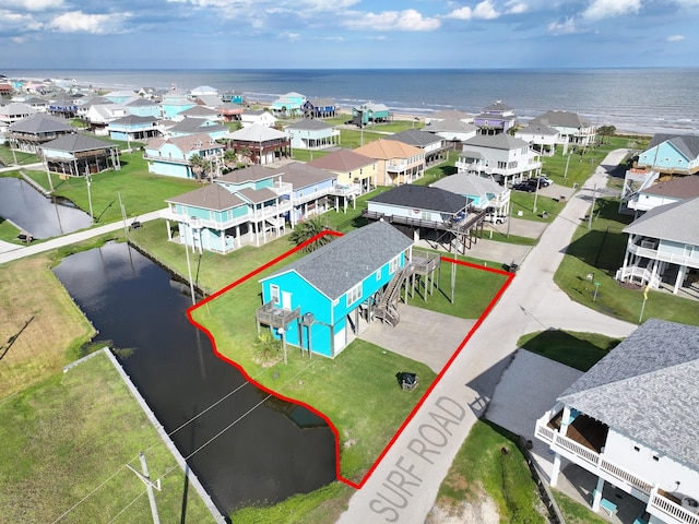 936 Surf Rd, Crystal Beach, TX 77650 - aerial perspective of suburban area with a nearby body of water and property boundaries highlighted