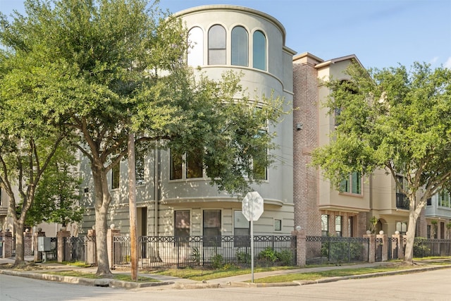 view of property with fence
