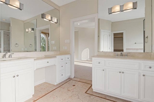 bathroom with marble tiled flooring, ornamental molding, two vanities, a shower stall, and a walk in closet