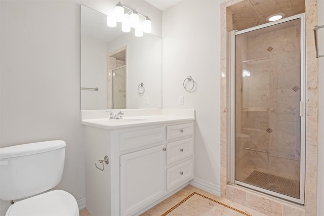 full bath with a stall shower, toilet, vanity, and baseboards