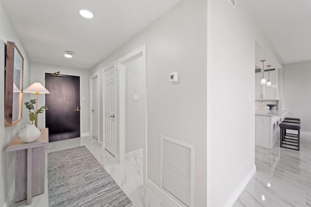 651 Bering Dr Unit 1406, Houston, TX 77057 - hall featuring light marble finish floors and baseboards