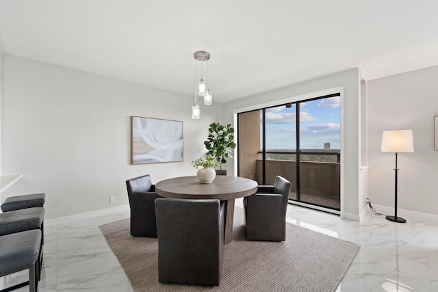 651 Bering Dr Unit 1406, Houston, TX 77057 - dining room featuring marble look tile flooring and baseboards