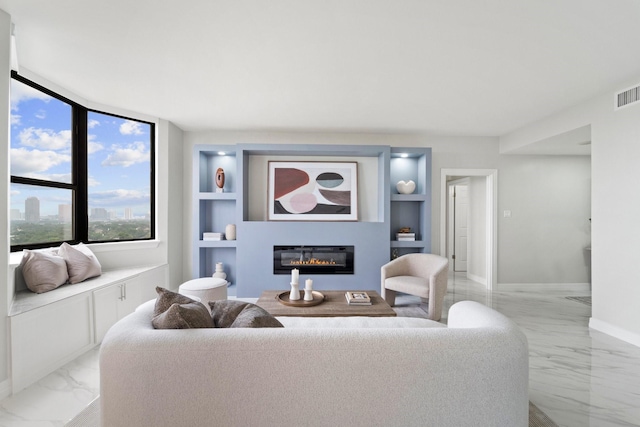 651 Bering Dr Unit 1406, Houston, TX 77057 - living room with light marble finish floors, built in shelves, and a glass covered fireplace