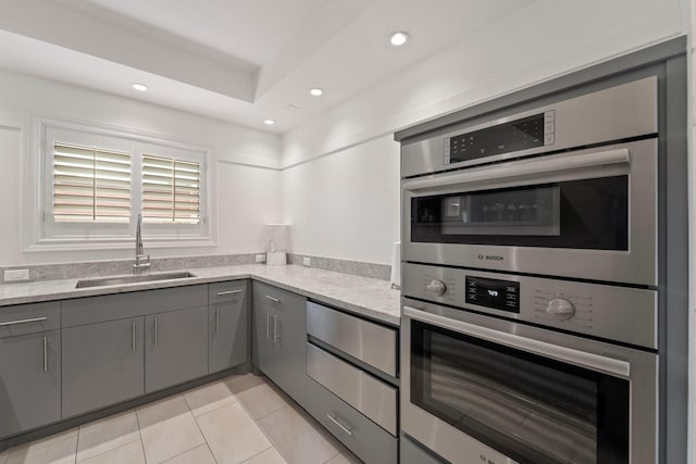 651 Bering Dr Unit 1406, Houston, TX 77057 - kitchen featuring gray cabinetry, a sink, light tile patterned floors, recessed lighting, and double oven