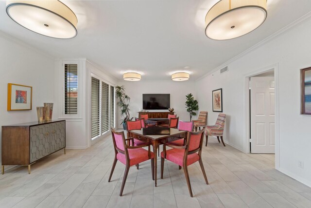 651 Bering Dr Unit 1406, Houston, TX 77057 - dining area featuring ornamental molding and baseboards