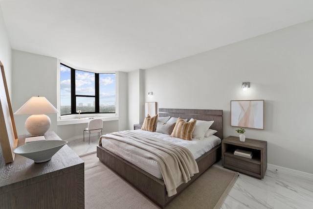 651 Bering Dr Unit 1406, Houston, TX 77057 - bedroom featuring light marble finish floors and baseboards