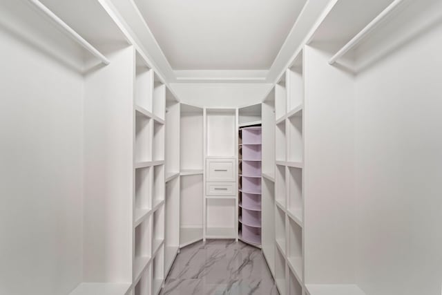 651 Bering Dr Unit 1406, Houston, TX 77057 - walk in closet featuring light marble finish flooring