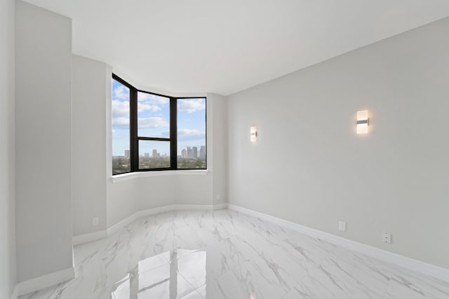 651 Bering Dr Unit 1406, Houston, TX 77057 - spare room featuring marble finish floors and baseboards