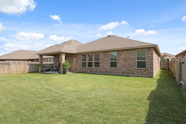 23522 Messina Harbor Dr, Katy, TX 77493 - back of property featuring brick siding, a patio area, and a shingled roof