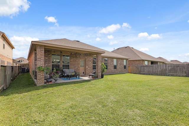 23522 Messina Harbor Dr, Katy, TX 77493 - rear view of house featuring brick siding, a patio, and a shingled roof