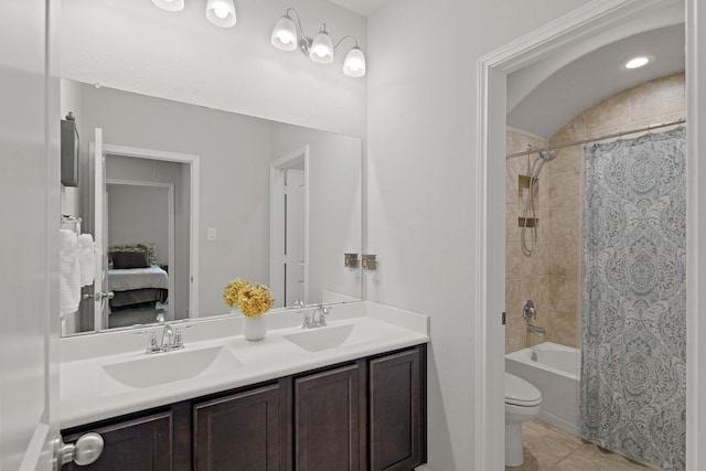 23522 Messina Harbor Dr, Katy, TX 77493 - ensuite bathroom featuring double vanity, tile patterned floors, shower / tub combo with curtain, and toilet