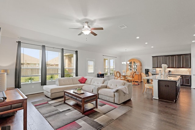 23522 Messina Harbor Dr, Katy, TX 77493 - living area with a ceiling fan, dark wood-style flooring, recessed lighting, and a chandelier