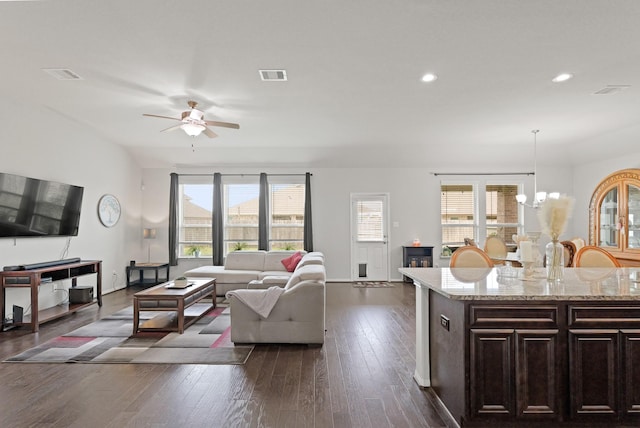 23522 Messina Harbor Dr, Katy, TX 77493 - living room with ceiling fan, dark wood-type flooring, a chandelier, and recessed lighting