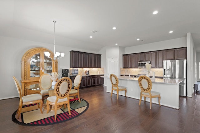 23522 Messina Harbor Dr, Katy, TX 77493 - dining room with a chandelier, recessed lighting, and dark wood-type flooring