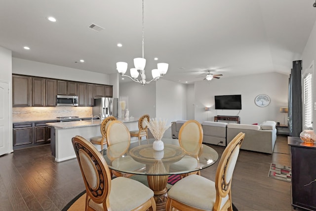 23522 Messina Harbor Dr, Katy, TX 77493 - dining space with dark wood-type flooring, ceiling fan, recessed lighting, and a chandelier