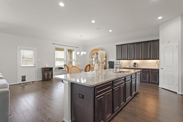 23522 Messina Harbor Dr, Katy, TX 77493 - kitchen featuring a sink, a chandelier, dark wood-type flooring, recessed lighting, and dark brown cabinets