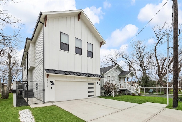 view of property exterior featuring board and batten siding, an attached garage, a standing seam roof, a gate, and driveway