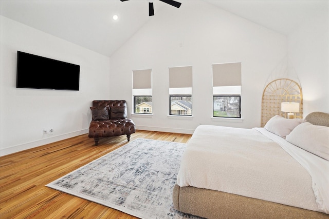 bedroom with high vaulted ceiling, baseboards, recessed lighting, wood finished floors, and a ceiling fan