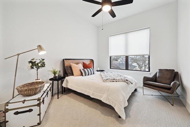 bedroom with carpet floors, lofted ceiling, and ceiling fan