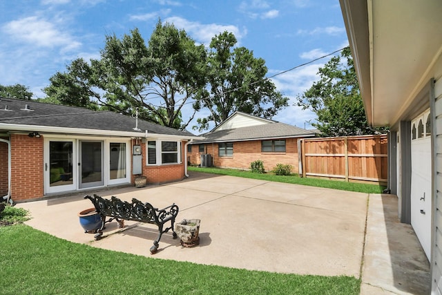 1815 Tannehill Dr, Houston, TX 77008 - back of house featuring brick siding, a patio area, and central air condition unit