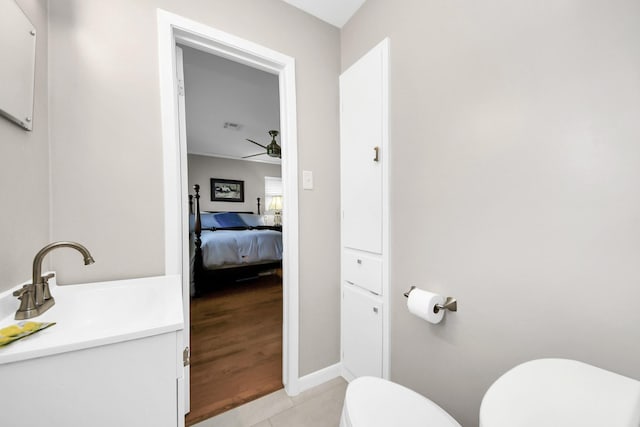 1815 Tannehill Dr, Houston, TX 77008 - bathroom featuring toilet, ceiling fan, tile patterned flooring, vanity, and connected bathroom