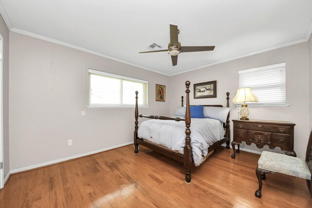 1815 Tannehill Dr, Houston, TX 77008 - bedroom with light wood finished floors, crown molding, baseboards, and ceiling fan