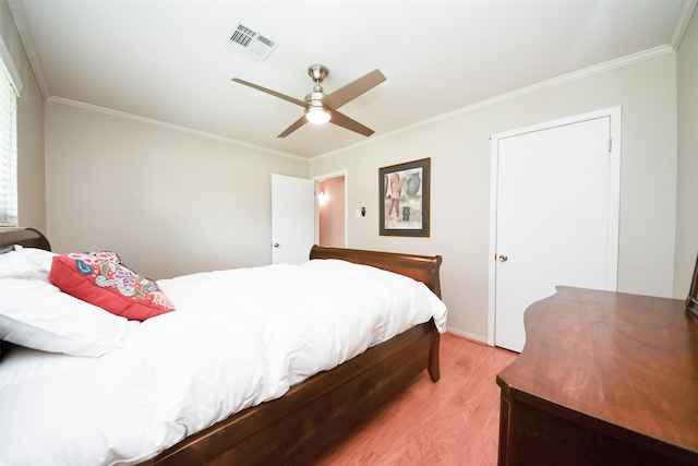 1815 Tannehill Dr, Houston, TX 77008 - bedroom with light wood-style flooring, ornamental molding, a ceiling fan, and baseboards