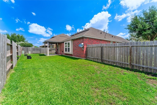 9967 Manor Spring Ln, Brookshire, TX 77423 - rear view of property featuring brick siding, a patio, and roof with shingles