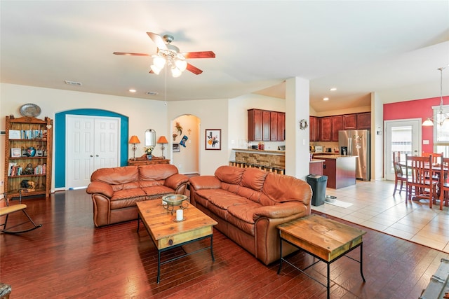 9967 Manor Spring Ln, Brookshire, TX 77423 - living room with ceiling fan, arched walkways, wood finished floors, and recessed lighting