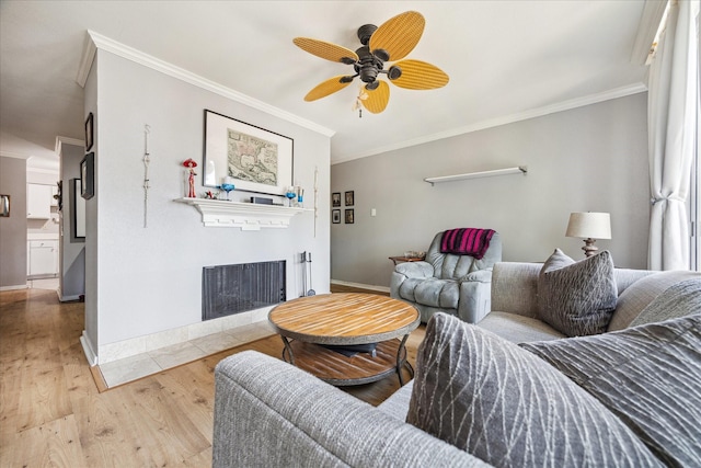 2333 Bering Dr Unit 236, Houston, TX 77057 - living room with ornamental molding, a fireplace with flush hearth, baseboards, wood finished floors, and ceiling fan