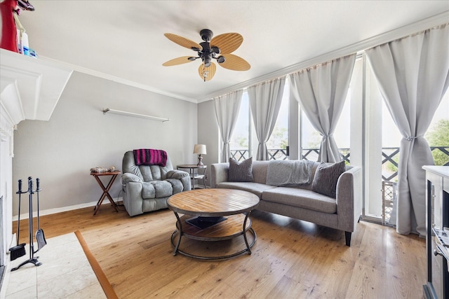 2333 Bering Dr Unit 236, Houston, TX 77057 - living area featuring crown molding, ceiling fan, baseboards, and wood finished floors