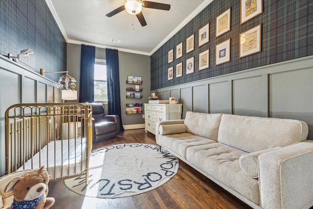 1004 Enid St Unit B, Houston, TX 77009 - living room featuring crown molding, a ceiling fan, wood finished floors, baseboards, and a decorative wall