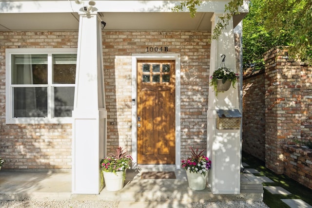 1004 Enid St Unit B, Houston, TX 77009 - doorway to property with brick siding and a porch