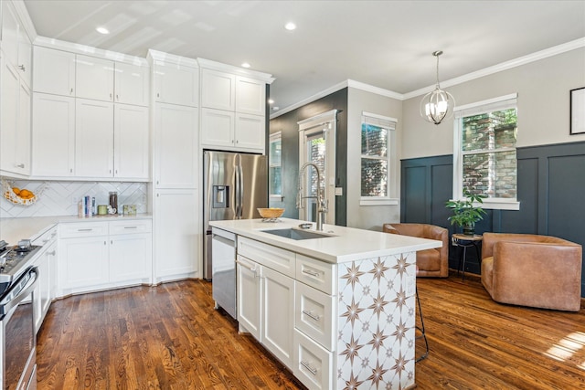 1004 Enid St Unit B, Houston, TX 77009 - kitchen with a sink, stainless steel appliances, dark wood-type flooring, light countertops, and crown molding