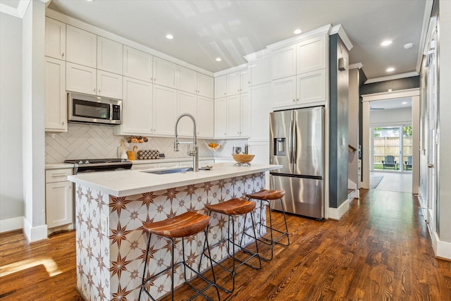 1004 Enid St Unit B, Houston, TX 77009 - kitchen featuring appliances with stainless steel finishes, a sink, dark wood finished floors, decorative backsplash, and baseboards