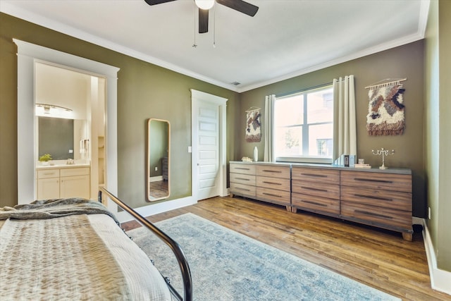 1004 Enid St Unit B, Houston, TX 77009 - bedroom with ornamental molding, wood finished floors, ensuite bathroom, baseboards, and a ceiling fan
