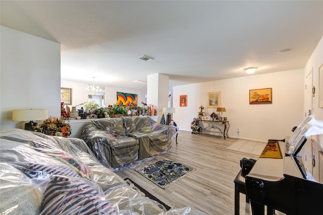 1414 Stevens Ct, Rosenberg, TX 77471 - living room with a chandelier and wood finished floors