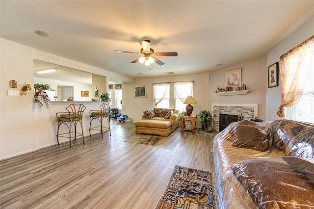 1414 Stevens Ct, Rosenberg, TX 77471 - living area with ceiling fan, wood finished floors, and a fireplace