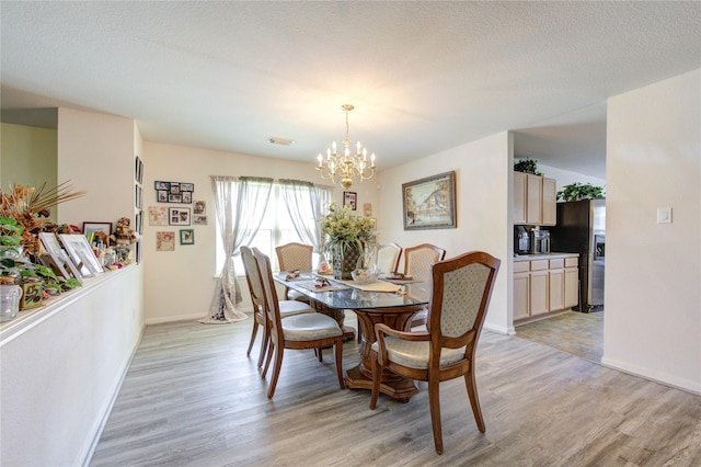 1414 Stevens Ct, Rosenberg, TX 77471 - dining area featuring light wood finished floors, a chandelier, and baseboards